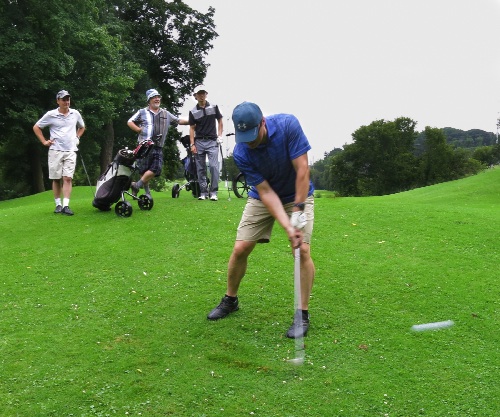 Fore Aces team member, Phil Bilan, makes a nice pitch shot on #8